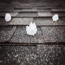 Hail on a Springdale roofing system after a big storm. 