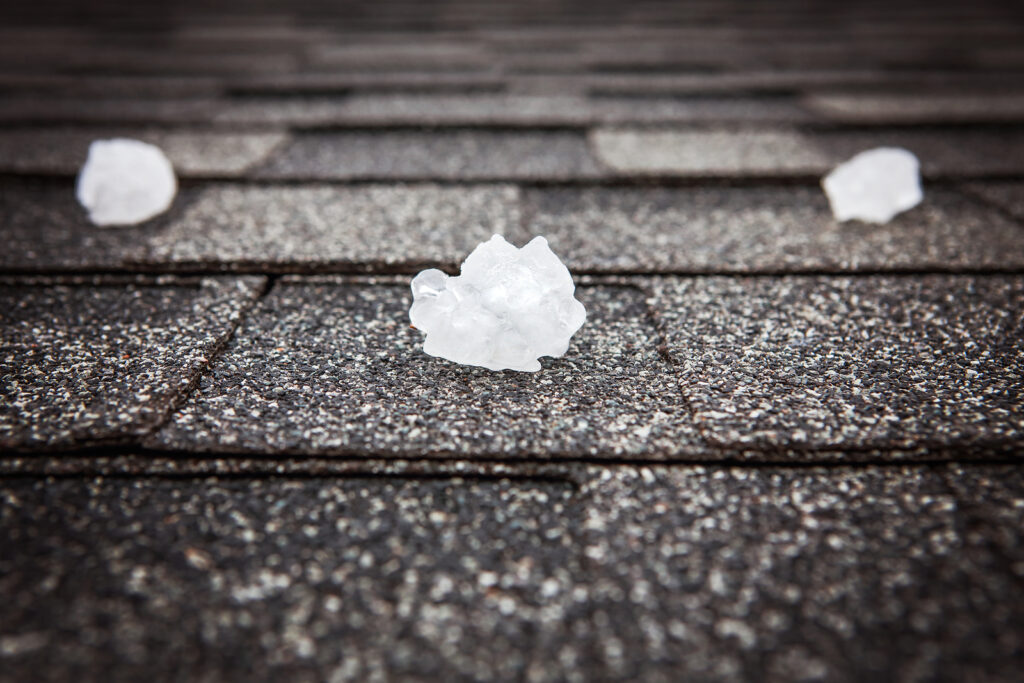 Hail on a Springdale roofing system after a big storm.