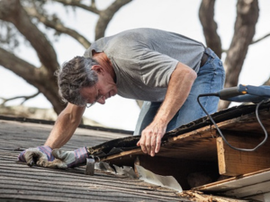Roofing repairs in progress in Grove