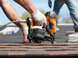Tahlequah roofing contractors working on roof installation