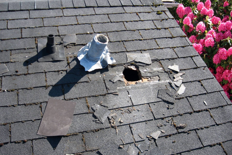 Damaged shingles on a Grove home roof