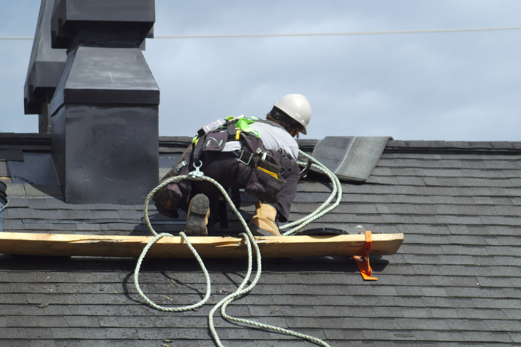 Roof repair work on a Springdale home